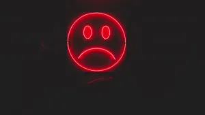 Neon Red Circle Sad Face Wallpaper
