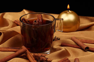 New Year's Cinnamon Tea And Candle Wallpaper