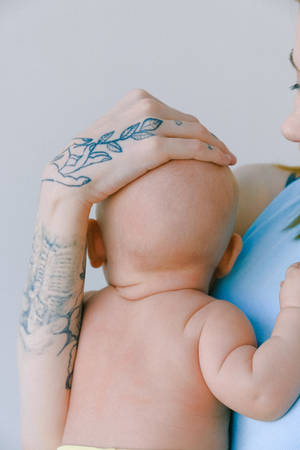 Newborn Baby Girl Arm Tattoo Wallpaper
