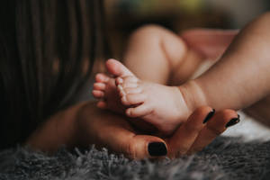 Newborn Baby Girl Black Nails Wallpaper
