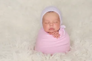 Newborn Baby Pink Bonnet Wallpaper