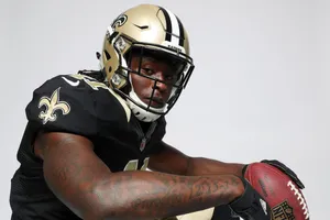 Nfl Running Back Alvin Kamara Breaks Into The Open Field Wallpaper