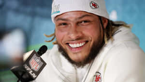 Nfl Superstar Tyrann Mathieu Celebrates Victory With Teammates. Wallpaper