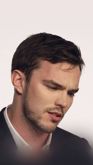 Nicholas Hoult Staring Down Wallpaper