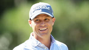 Nick Watney Intently Fishing On A Serene Blue Lake Wallpaper