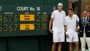 Nicolas Mahut With Isner At Wimbledon Wallpaper