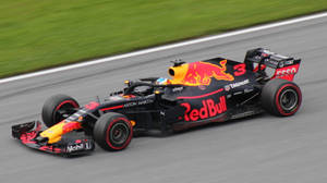 Night Thrill - Red Bull Racing Car In Action Wallpaper