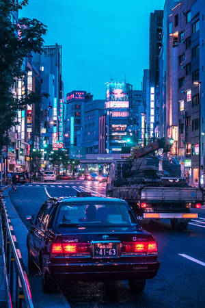 Nightlife Aesthetics: Jdm Car Illuminating The Tokyo Streets Wallpaper