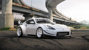 Nissan 370z With Intersecting Highways Wallpaper