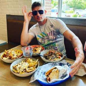 Notable Mixed Martial Artist Stephen Thompson Triumphantly Standing In The Ring Wallpaper