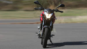 Ns 200 Motorcycle On Road Blurred Effect Wallpaper