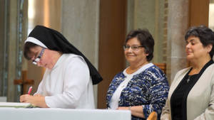 Nun Signing With Two Women Wallpaper