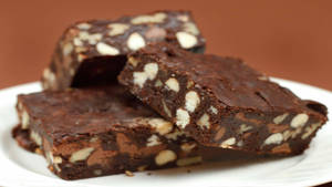 Nutty Brownies On White Plate Wallpaper