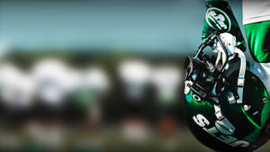 Ny Jets Player Holding A Helmet Wallpaper