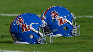 Ole Miss Football Helmets On Field Wallpaper