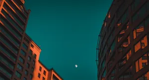 Orange And Teal City Buildings View Wallpaper