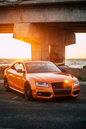 Orange Audi Car By The Sea Wallpaper