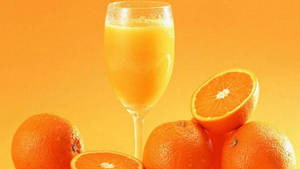 Orange Fruit Juice In Glass Wallpaper