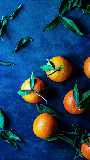 Orange Fruits On Blue Mat Wallpaper