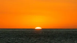 Orange Sunset And Blue Ocean Wallpaper