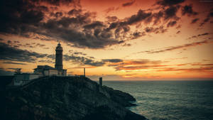 Orange Sunset Lighthouse Wallpaper