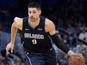 Orlando Magic Nba Player Nikola Vucevic Powerful Center Wallpaper