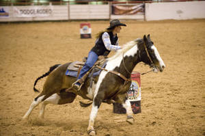 Our Champion Barrel Racer Paige Kuester Celebrates Her Latest Win With Her Beloved Horse. Wallpaper