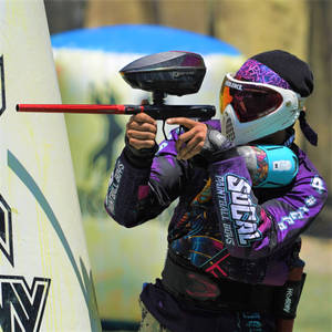 Paintball Player Aiming Behind A Bunker Wallpaper