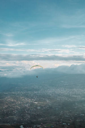Paragliding Above Banos City Wallpaper