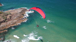 Paragliding Above Sea Wallpaper