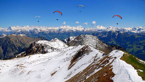 Paragliding Above Snow Mountains Wallpaper