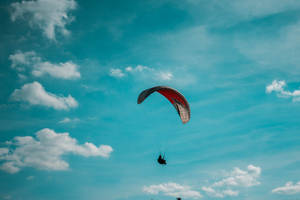 Paragliding High In The Sky Wallpaper