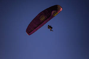 Paragliding In Dark Blue Sky Wallpaper