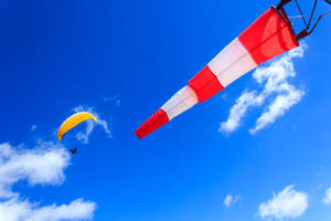 Paragliding Near Wind Indicator Flag Wallpaper