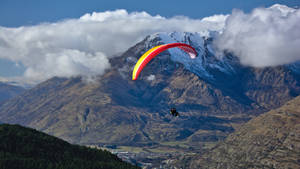 Paragliding Tandem Near Clouds Wallpaper