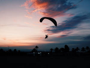 Paragliding Touching Down Silhouette Wallpaper