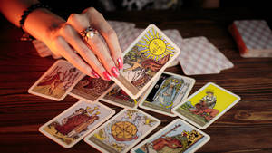 Paranormal Tarot Cards On Table Wallpaper