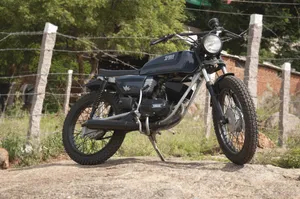 Parked Black Yamaha Rx100 Tracker Wallpaper