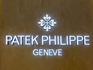 Patek Philippe Logo On Wall Wallpaper