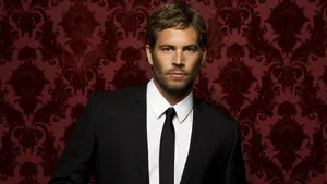 Paul Walker Demonstrating Classic Elegance In A Men's Suit Wallpaper