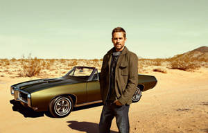 Paul Walker Standing Beside His Fast Car. Wallpaper