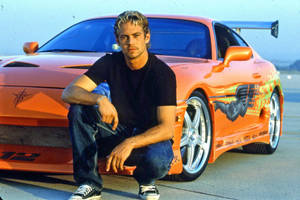 Paul Walker With His Beloved Car Wallpaper