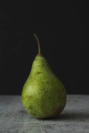 Pear Fruit On Concrete Surface Wallpaper
