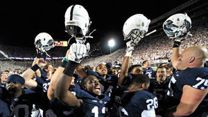 Penn State Raising Helmets Wallpaper