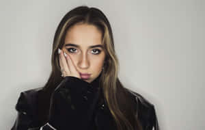 Pensive Young Womanin Black Jacket Wallpaper