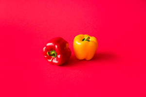 Peppers On Red Screen Wallpaper