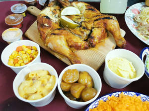 Peri Peri Chicken Charcoal With Several Side Dishes Wallpaper