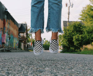 Person In Vans Checkered Shoes Wallpaper