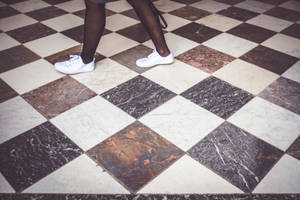 Person On Checkered Floor Wallpaper