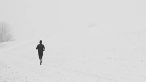 Person Running In Snow Road Wallpaper